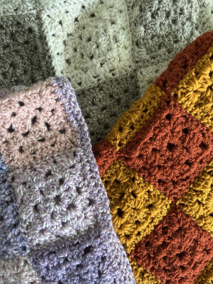 Two hand‑crocheted granny‑square blankets in pastel and autumn colours, showing detailed stitch work and joined motifs.