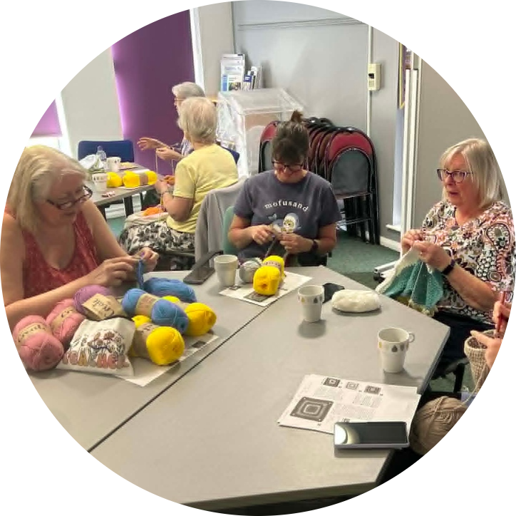 A welcoming scene of Swindon Big Knit volunteers crafting, knitting and enjoying time together at the Haydon Wick session.